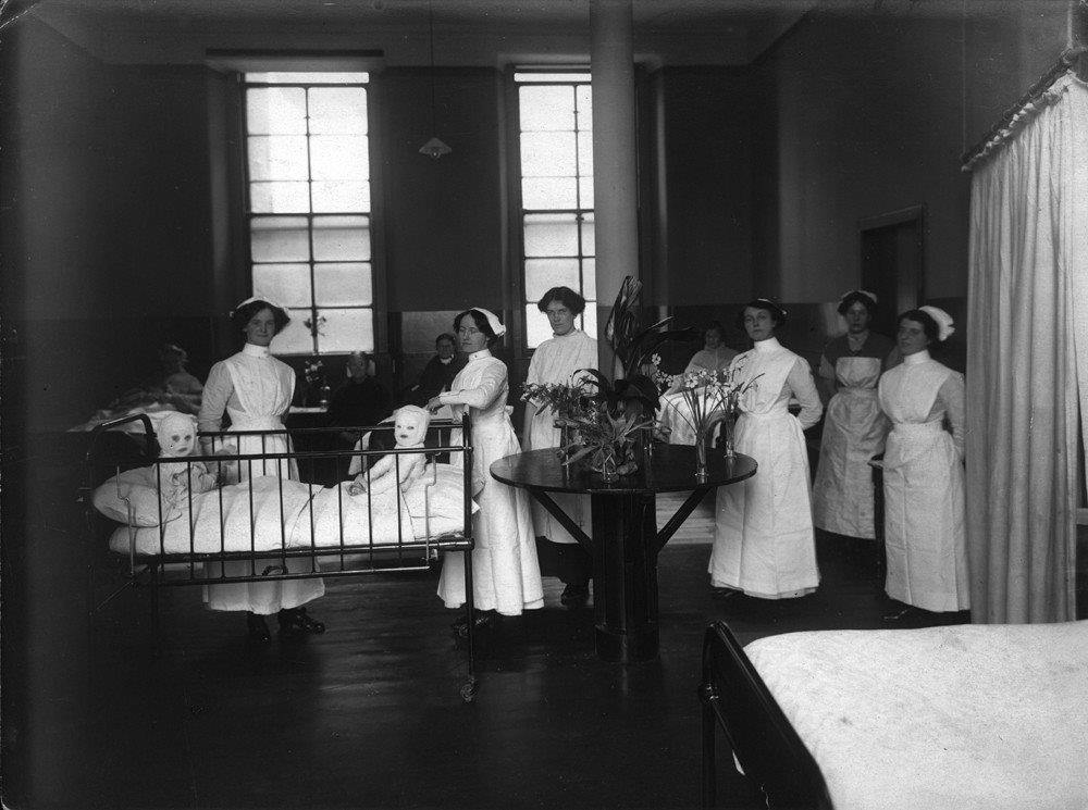 Children's ward pre 1914 - Ellen Brown Orr, first women surgeon in West of Scotland is seen behind the table to the right of the bed